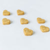 Heart-shaped dog treats on a white background