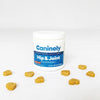 Caninel Hip & Joint dog supplement container with scattered soft chews on a white background